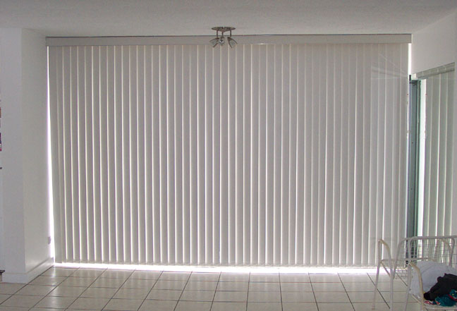 View to the Enclosed Lanai, with vertical blinds