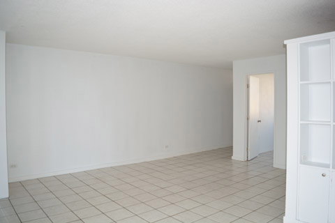 Living room and the front entrance, into the Second Bedroom