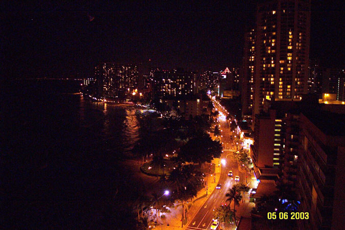 Views from the Lanai of Condo Unit #2002, Night view of Waikiki, up Kalakaua Ave, and beach front.