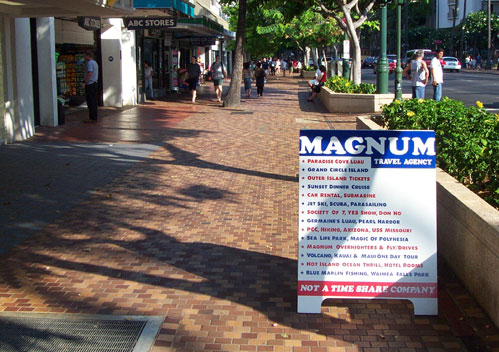 Illegal Magnum Business Sign on Kalakaua Ave signwalk